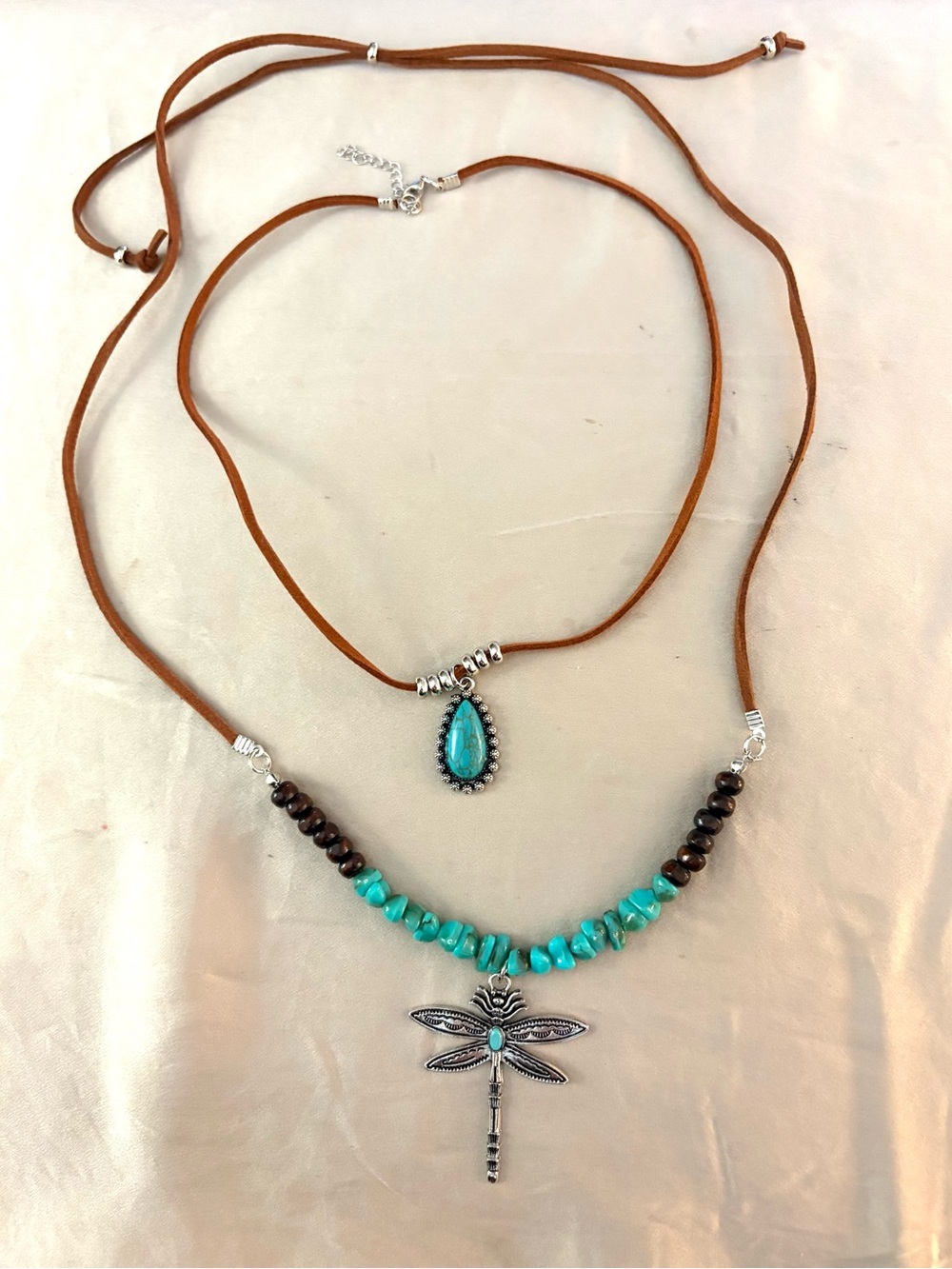 Two cowgirl boho necklaces. One choker and one longer adjustable necklace. NWT.